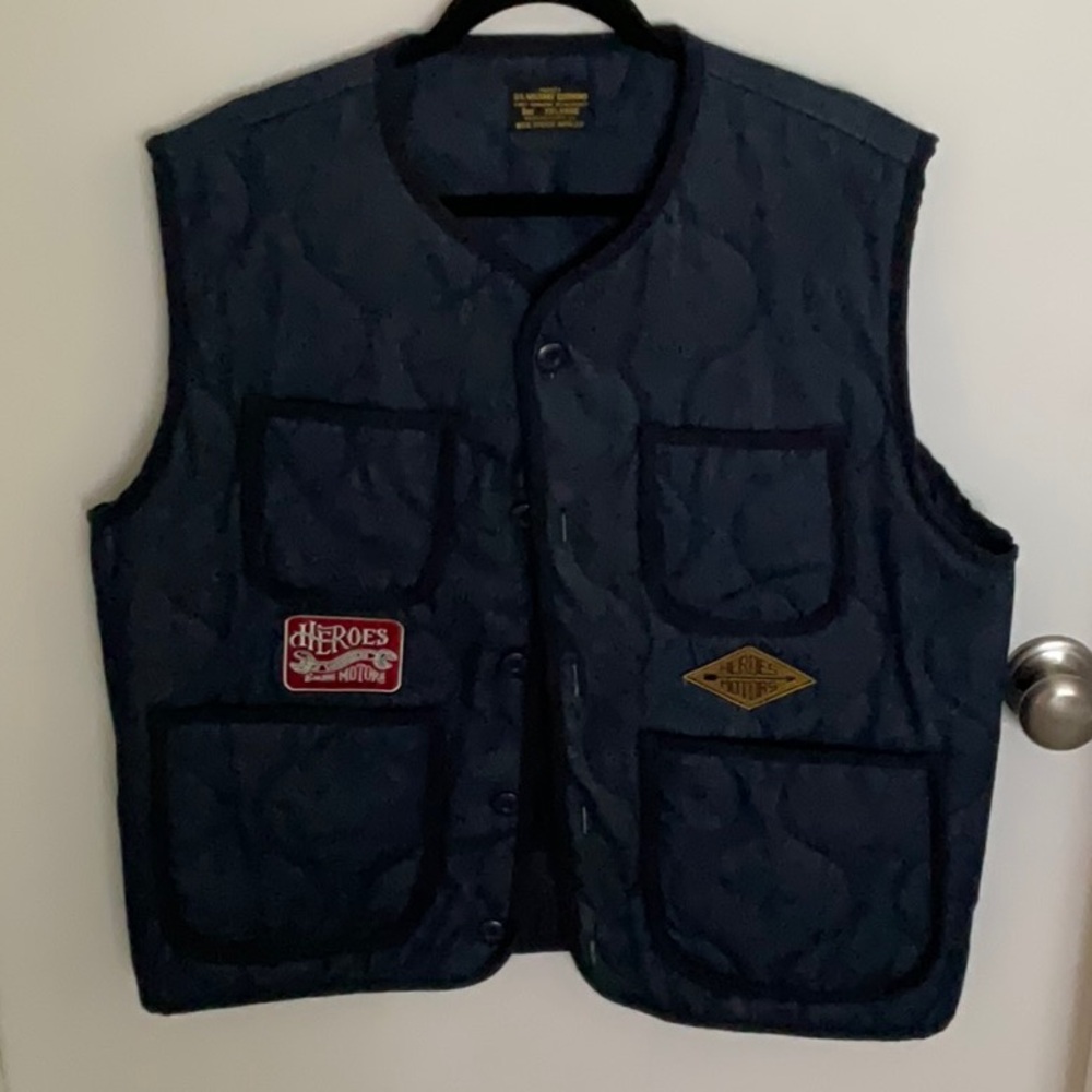 Denim vest with patches. Size XL (not xxl like the label says)